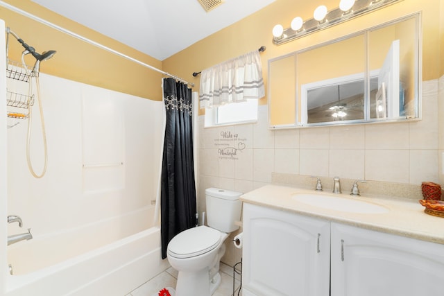 full bathroom featuring shower / bath combo, vanity, tile walls, tile patterned flooring, and toilet