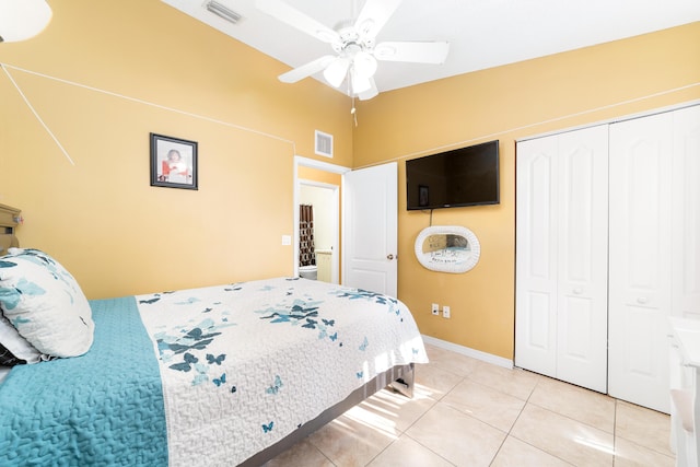 bedroom with ceiling fan and light tile patterned flooring