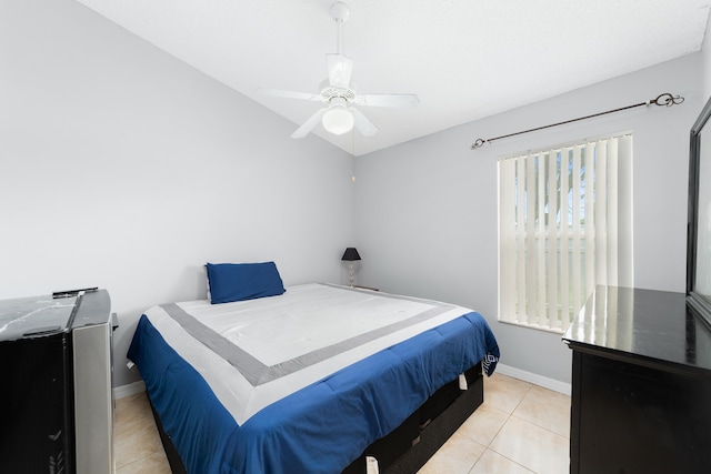 tiled bedroom with ceiling fan