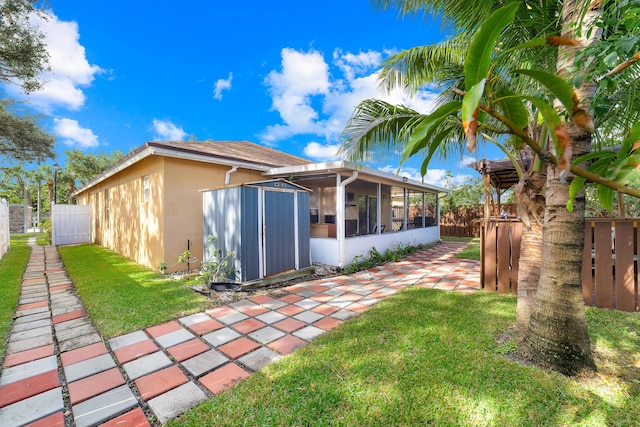 rear view of property featuring a lawn