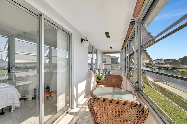 balcony featuring a water view