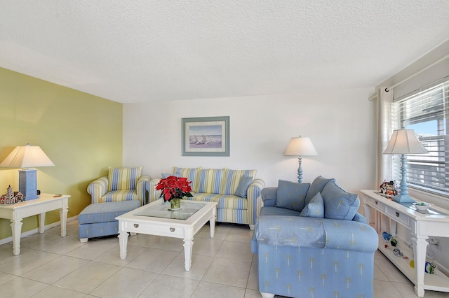 living room with light tile patterned floors and a textured ceiling