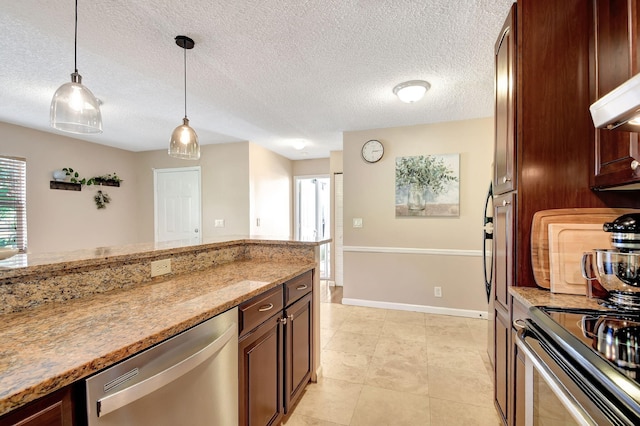 kitchen featuring light stone countertops, dishwasher, pendant lighting, and a textured ceiling