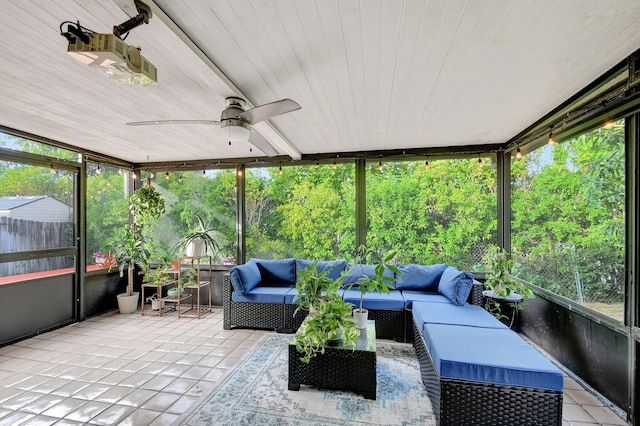 sunroom with ceiling fan, plenty of natural light, and wood ceiling