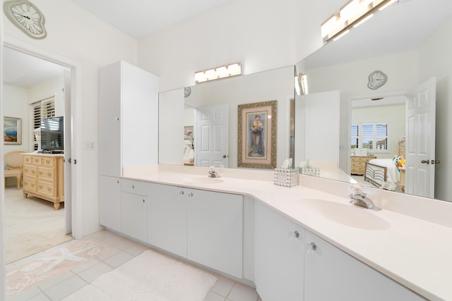 bathroom featuring tile patterned flooring and vanity