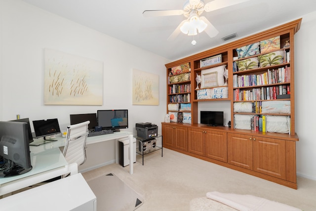 office area featuring light carpet and ceiling fan