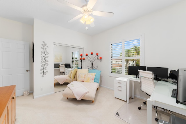 office featuring light carpet and ceiling fan