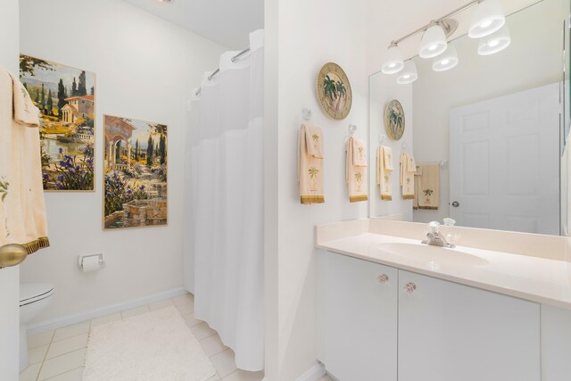 bathroom with tile patterned floors and toilet