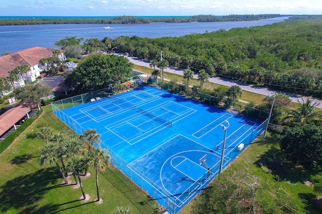 birds eye view of property with a water view