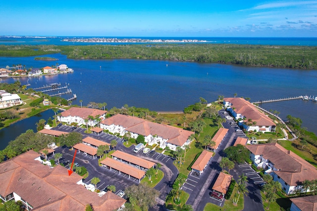 birds eye view of property featuring a water view