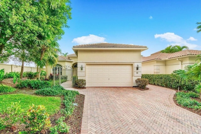 mediterranean / spanish-style home with a garage