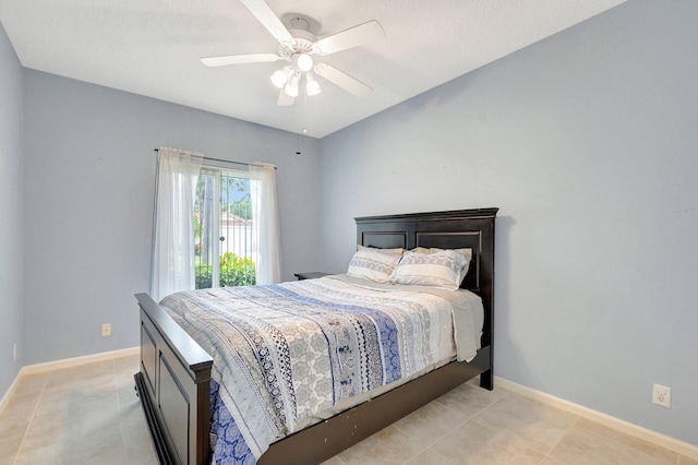 bedroom with ceiling fan and light tile patterned floors