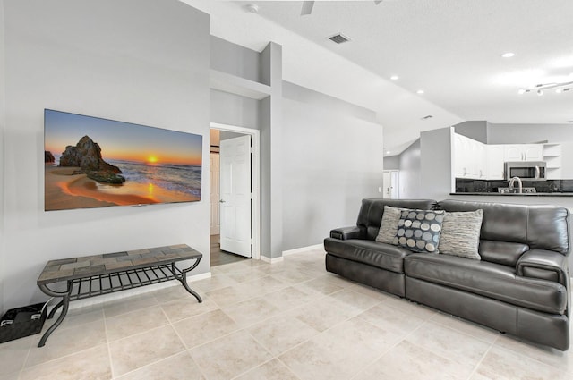 tiled living room with vaulted ceiling