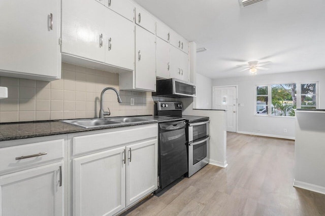 kitchen with ceiling fan, sink, light hardwood / wood-style flooring, white cabinets, and appliances with stainless steel finishes