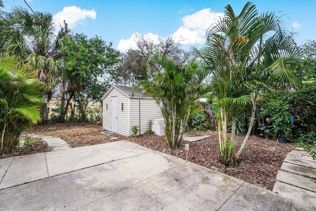 view of patio featuring a storage shed