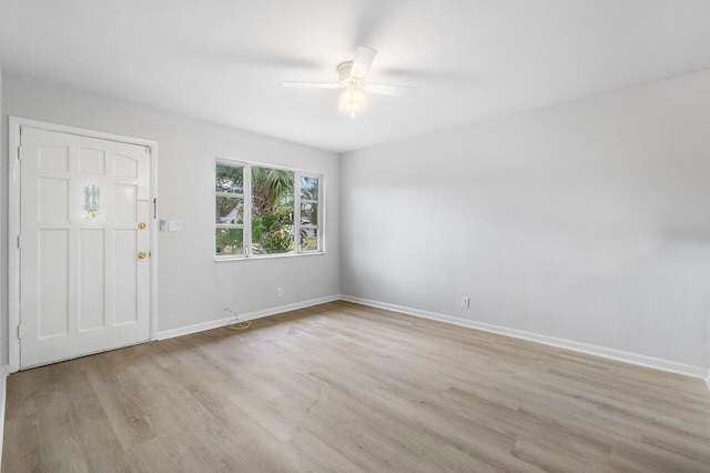 foyer with ceiling fan and light hardwood / wood-style floors