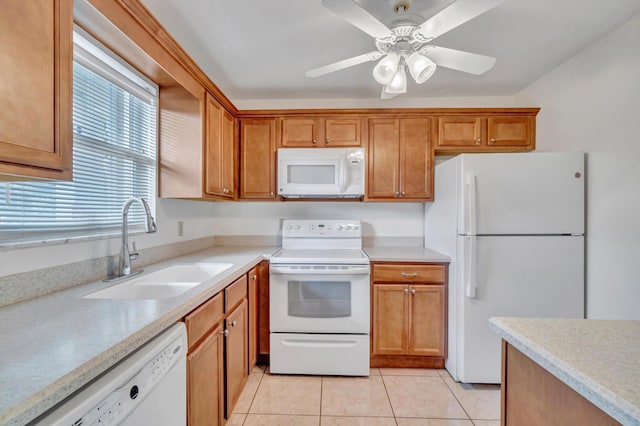 kitchen with ceiling fan, sink, light tile patterned floors, and white appliances