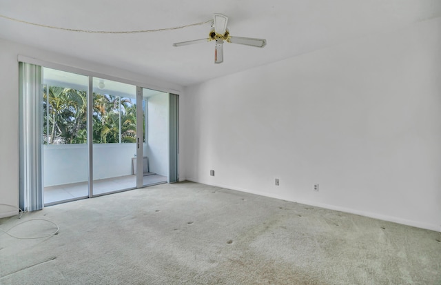 empty room with carpet and ceiling fan