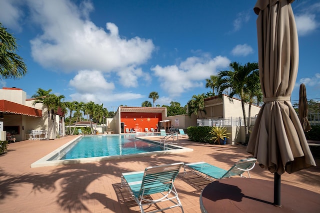 view of swimming pool featuring a patio area