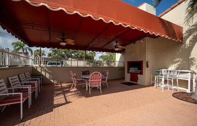 view of patio / terrace featuring ceiling fan