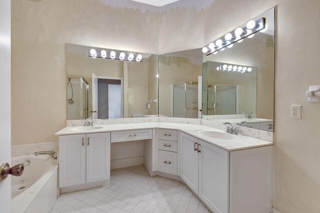 full bath with a bath, a shower stall, vanity, and tile patterned floors