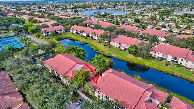 bird's eye view with a water view and a residential view