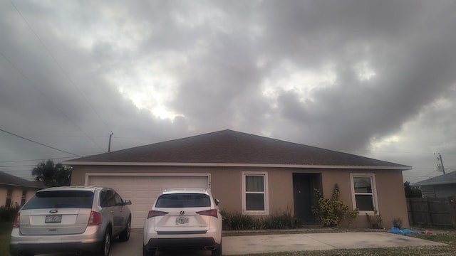 single story home featuring a garage