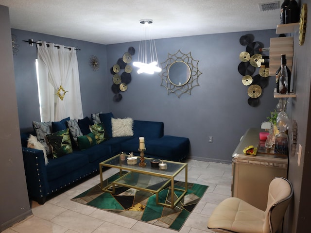 tiled living room with a textured ceiling