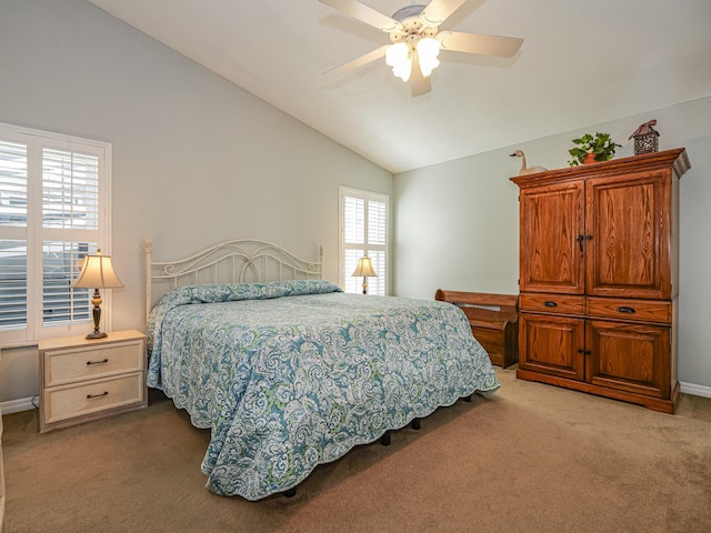 carpeted bedroom with vaulted ceiling and ceiling fan