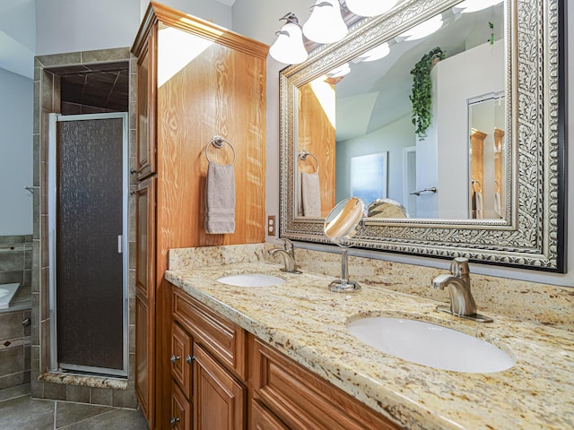 bathroom with vanity, tile patterned floors, and walk in shower