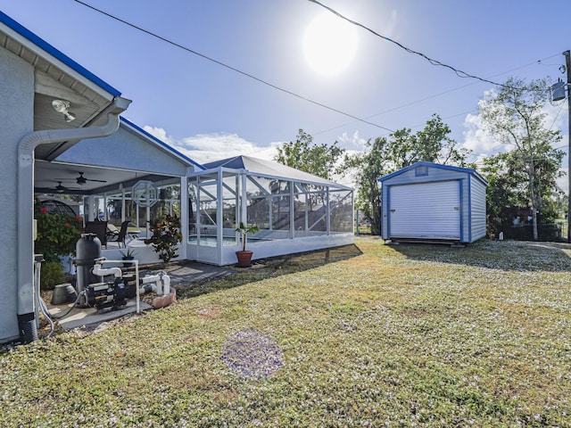 view of yard with a patio area, a storage unit, and a lanai