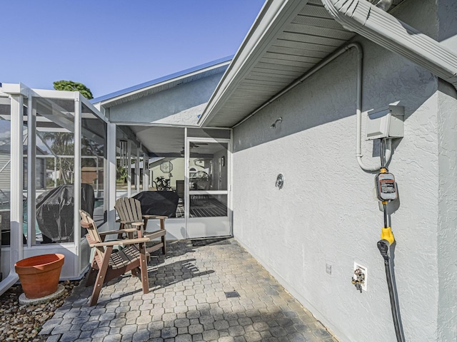 view of patio with a lanai