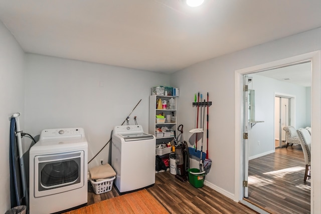 laundry room with dark hardwood / wood-style floors and independent washer and dryer