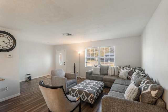 living room with dark hardwood / wood-style floors