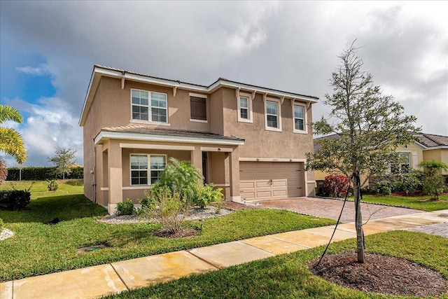 view of front of house featuring a front yard and a garage