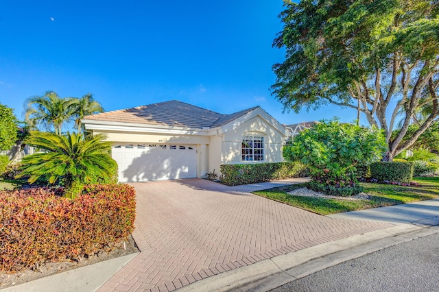 single story home with a garage