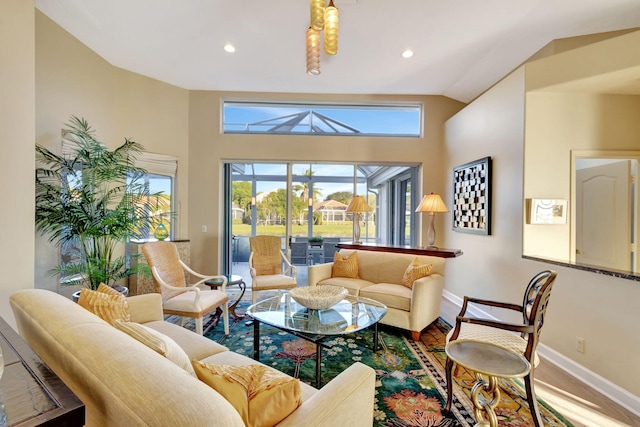 living room featuring vaulted ceiling