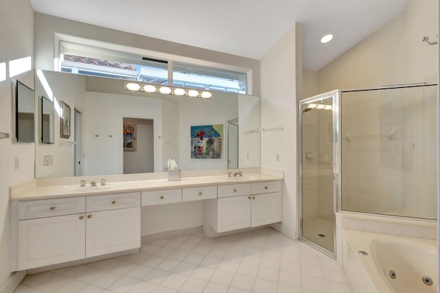 bathroom featuring vanity, tile patterned floors, and plus walk in shower