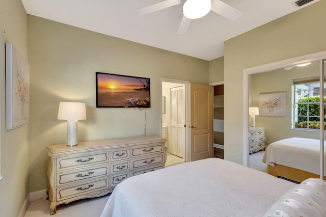 bedroom with ceiling fan and light colored carpet