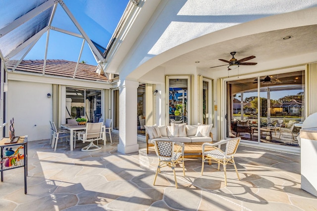 view of patio with ceiling fan and an outdoor living space