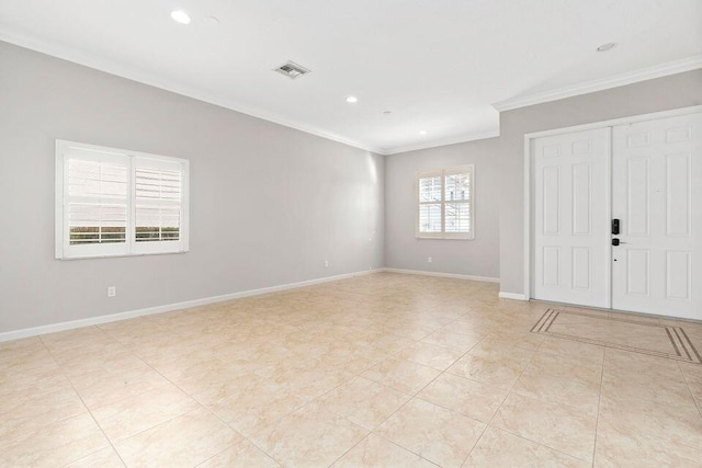 tiled spare room with crown molding