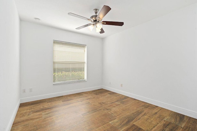 spare room featuring wood-type flooring