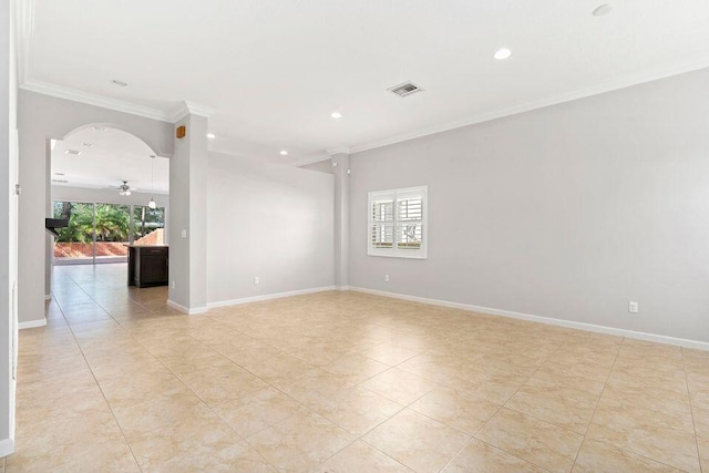 unfurnished room with ceiling fan, plenty of natural light, light tile patterned floors, and ornamental molding