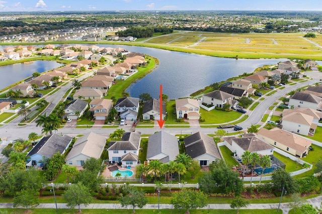 birds eye view of property with a water view