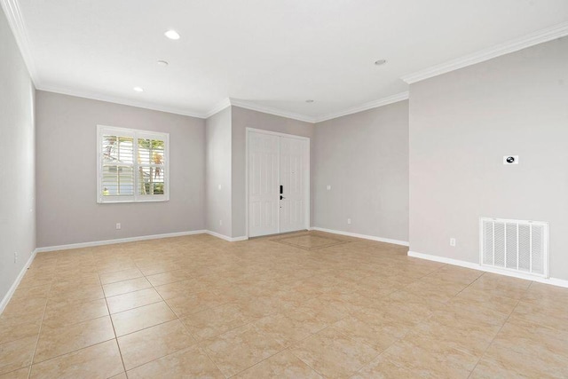 spare room featuring ornamental molding