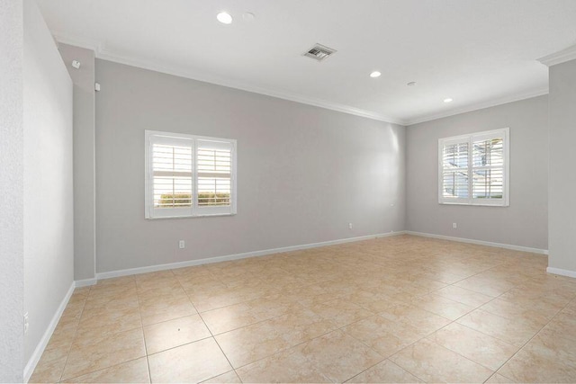 unfurnished room featuring crown molding and light tile patterned flooring