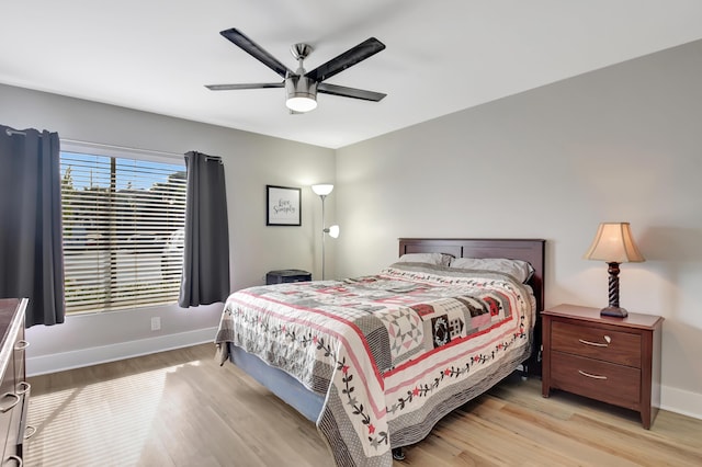 bedroom featuring ceiling fan and light hardwood / wood-style floors