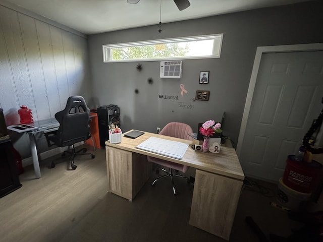 office with ceiling fan, light hardwood / wood-style flooring, wood walls, and a wall mounted air conditioner