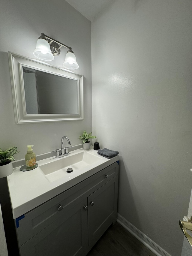 bathroom featuring vanity and hardwood / wood-style flooring