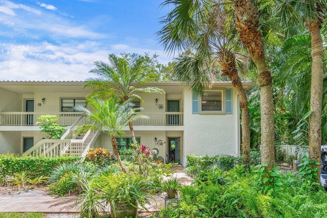 view of front of home featuring a balcony